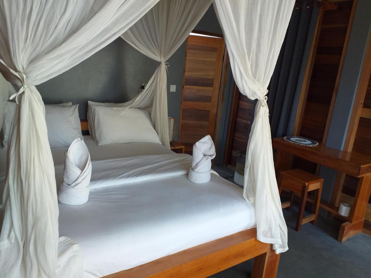 The Geckos Homestay Kelimutu Pokoj fotografie